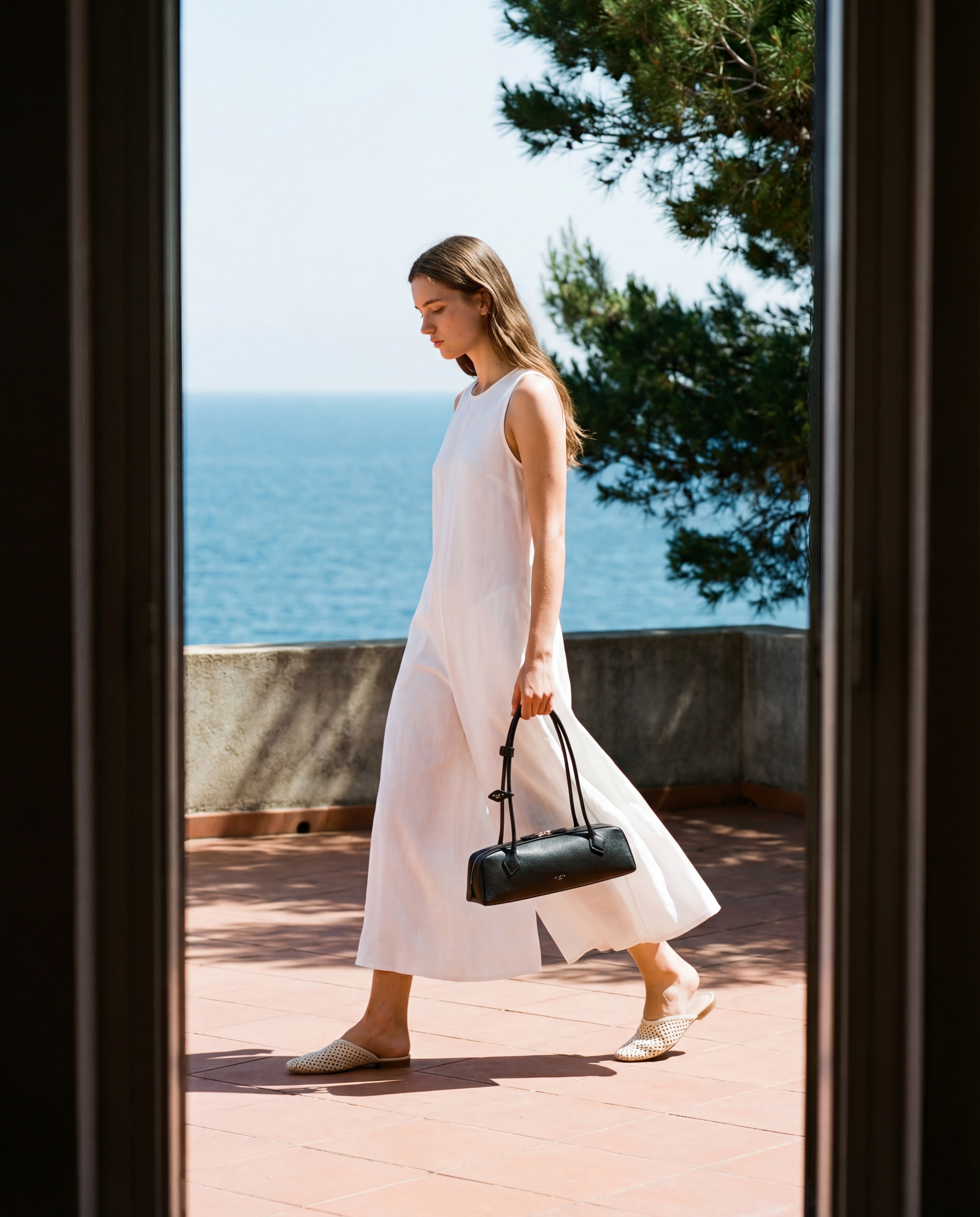 Mediterranean terrace walk with a minimalist handbag — example 2 (fashion, AI generation on Cheeppy)